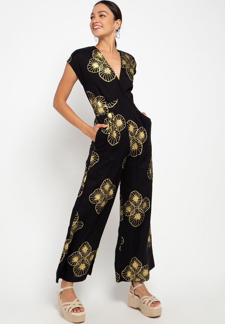 Introducing our elegant short sleeve jumpsuit, a timeless ensemble that effortlessly combines style with sustainability. Crafted with care and consideration, this jumpsuit features delicate cross laces and an elastic back for a comfortable and flattering fit. Made from sustainable viscose fabric, this jumpsuit not only looks good but also feels good knowing it's environmentally friendly. Perfect for those who appreciate both fashion and eco-consciousness.